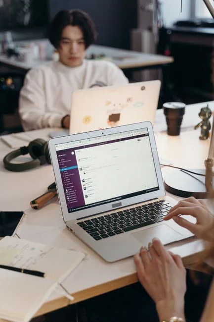 Vector icons showing a modern phone beside a computer monitor and a credit card, with gray lines on a purple background